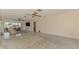 Spacious living room area with sliding glass doors to a patio, neutral walls, and plush carpeting at 322 Oakwood Cir, Englewood, FL 34223