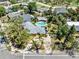 Charming home featuring a spacious driveway and private backyard pool with a covered patio, perfect for entertaining at 337 Harbor S Dr, Venice, FL 34285