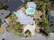 Expansive aerial view of a landscaped property, featuring a pool and lush greenery, ideal for private living at 337 Harbor S Dr, Venice, FL 34285