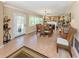 Inviting dining room featuring tile floors, natural light, and classic decor with a fireplace at 337 Harbor S Dr, Venice, FL 34285