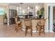 Bright kitchen featuring a breakfast bar with granite countertops and stainless steel appliances at 337 Harbor S Dr, Venice, FL 34285