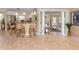 Open-concept living space with bar, tile floors and lots of natural light at 337 Harbor S Dr, Venice, FL 34285