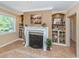 Elegant living room showcasing a fireplace, built-in shelving, and neutral tones at 337 Harbor S Dr, Venice, FL 34285