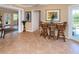 Open-concept space boasts tile floors and a view into the dining room with large columns at 337 Harbor S Dr, Venice, FL 34285