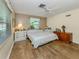Cozy main bedroom featuring hardwood floors, and lots of natural light at 337 Harbor S Dr, Venice, FL 34285