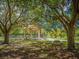 Picturesque park gazebo with a picnic table beneath the trees providing a serene and relaxing environment at 337 Harbor S Dr, Venice, FL 34285