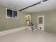 Finished basement featuring painted walls, a painted floor, and exterior access at 379 Harbor Isles Dr, North Port, FL 34287