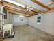 Unfinished basement featuring concrete floors, painted walls, and exposed beams at 379 Harbor Isles Dr, North Port, FL 34287