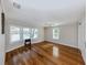 Spacious bedroom featuring hardwood floors, large windows, and ample natural light at 379 Harbor Isles Dr, North Port, FL 34287