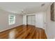 Bedroom features hardwood floors, closet, and ample natural light at 379 Harbor Isles Dr, North Port, FL 34287