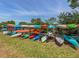 Community kayak storage racks with colorful kayaks and canoes, offering easy access to water activities at 379 Harbor Isles Dr, North Port, FL 34287