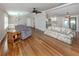 Spacious living room featuring hardwood floors and an open layout, perfect for entertaining and relaxation at 379 Harbor Isles Dr, North Port, FL 34287
