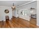 Bright living room features hardwood floors, a built-in bar and an open floor plan for a modern feel at 379 Harbor Isles Dr, North Port, FL 34287