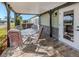 Covered patio with outdoor seating perfect for relaxing and enjoying the fresh air at 379 Harbor Isles Dr, North Port, FL 34287
