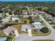 Beautiful residential neighborhood with mature trees, ponds, and well-maintained homes create a serene and picturesque setting at 4062 Green Tree Ave, Sarasota, FL 34233
