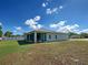 Expansive, grassy yard featuring a screened-in patio, perfect for outdoor living and entertaining with ample space at 4062 Green Tree Ave, Sarasota, FL 34233