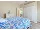 Bedroom featuring wood floors, closet, and doorway leading to another room at 4062 Green Tree Ave, Sarasota, FL 34233
