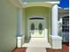 Up-close view of the double doors, showing the intricate detailing and bright entryway at 4062 Green Tree Ave, Sarasota, FL 34233