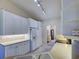 Spacious kitchen featuring white cabinets and modern appliances, perfect for cooking at 4062 Green Tree Ave, Sarasota, FL 34233