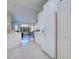 Bright kitchen with white cabinets, modern appliances, and an open view to the living area at 4062 Green Tree Ave, Sarasota, FL 34233