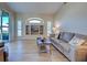 Cozy living room with built-in shelving, hardwood floors, and a sliding glass door at 4062 Green Tree Ave, Sarasota, FL 34233