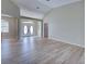 Living room featuring wood floors, a view of the double door entryway, and an open layout at 4062 Green Tree Ave, Sarasota, FL 34233