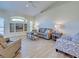 Bright living room featuring hardwood floors, comfortable seating, and natural light at 4062 Green Tree Ave, Sarasota, FL 34233