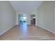 Living room with wood floors, leading to a dining area and patio at 4062 Green Tree Ave, Sarasota, FL 34233
