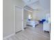 Bright main bedroom with ceiling fan and natural lighting at 4062 Green Tree Ave, Sarasota, FL 34233