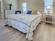 Main bedroom featuring a large window and neutral decor at 4062 Green Tree Ave, Sarasota, FL 34233