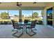 Relaxing screened patio offers comfortable seating and serene views of the surrounding landscape at 4062 Green Tree Ave, Sarasota, FL 34233