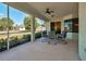 Inviting screened patio provides a tranquil outdoor retreat with comfortable seating and scenic backyard views at 4062 Green Tree Ave, Sarasota, FL 34233