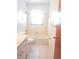 A white tiled bathroom featuring a vanity, toilet and bathtub at 407 Bahama Rd, Venice, FL 34293
