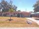 Charming single story home with an attached garage and palm tree in the front yard at 407 Bahama Rd, Venice, FL 34293