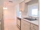 The kitchen features tiled floors, laminate countertops, and an undermount sink at 407 Bahama Rd, Venice, FL 34293