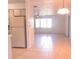 View of a combination kitchen and living room with tiled floors and a window for natural light at 407 Bahama Rd, Venice, FL 34293