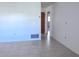 Neutral room with tile flooring and white walls and a view of a door and hallway at 407 Bahama Rd, Venice, FL 34293