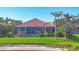 View of backyard with private pool and surrounding greenery at 4326 Corso Venetia Blvd, Venice, FL 34293