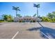 Community clubhouse surrounded by palm trees at 4326 Corso Venetia Blvd, Venice, FL 34293