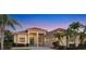Charming single-story home with a tile roof, manicured landscaping, and a welcoming front entrance at 4326 Corso Venetia Blvd, Venice, FL 34293