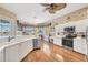 Bright kitchen featuring stainless steel appliances, ample counter space, and a lovely lake view at 4326 Corso Venetia Blvd, Venice, FL 34293