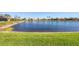 Scenic view of a tranquil pond surrounded by well-maintained lawns at 4326 Corso Venetia Blvd, Venice, FL 34293