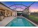 Inviting screened-in pool and spa with a covered patio for entertaining and enjoying the outdoors at 4326 Corso Venetia Blvd, Venice, FL 34293