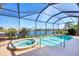Inviting screened-in pool and spa boasting stunning lake views, creating a private oasis at 4326 Corso Venetia Blvd, Venice, FL 34293