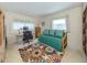 Comfortable bedroom with a daybed and work space, providing a versatile area for sleep, study, and relaxation at 444 Driftwood Rd, Venice, FL 34293