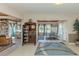 Open-concept living room with views into a library and a dining area at 444 Driftwood Rd, Venice, FL 34293
