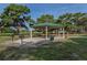 Community picnic area with grills, tables, and metal gazebo at 444 Driftwood Rd, Venice, FL 34293