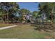 Community playground with climbing, slides, and swings at 444 Driftwood Rd, Venice, FL 34293