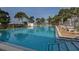 Large swimming pool with nearby gazebo for residents to enjoy at 444 Driftwood Rd, Venice, FL 34293