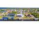 Aerial view of waterfront homes with boat docks and screened lanais along a canal at 5265 Neville Ter, Port Charlotte, FL 33981